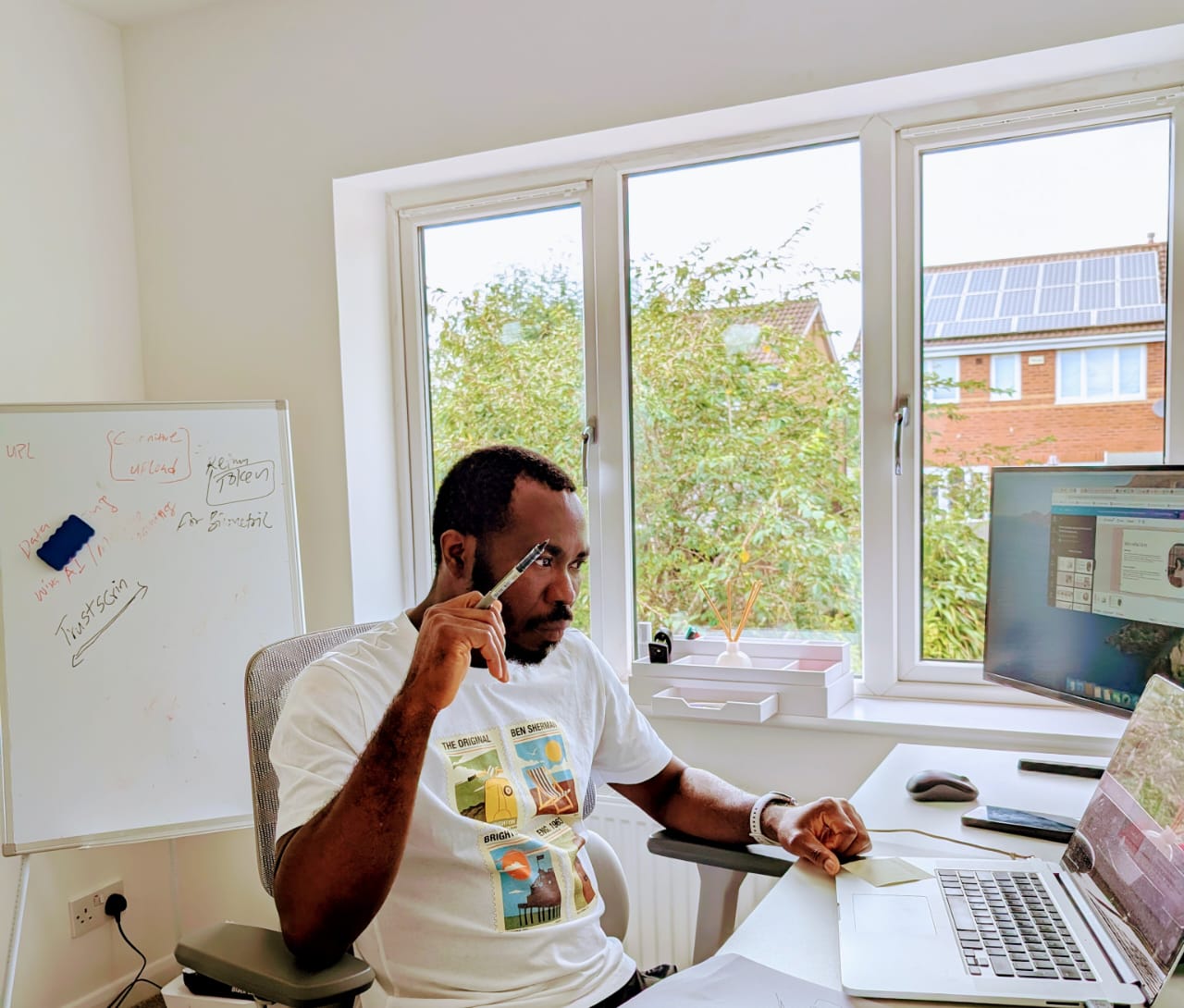 Developer workspace with laptop, coffee, and code on screen